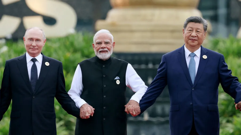 (From left) Russian President Vladimir Putin, Indian Prime Minister Narendra Modi and Chinese President Xi Jinping pose for a photo at the Brics summit in Delhi